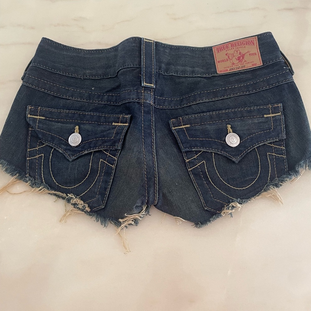 Designer Lot, low rise jeans, shorts and hat.